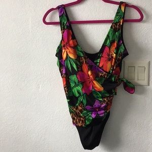 Longitude bathing suit size 12, multi colors and has a tie on the side. NWOT